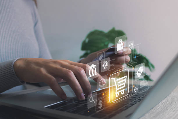 Shopping online icon, e-commerce concept.Woman hand using laptop computer and holding credit card with online shopping at home.internet banking, spending money, credit card.