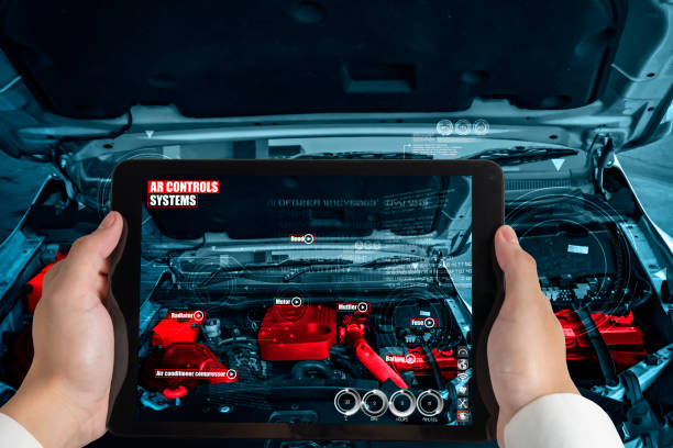 Engineer use augmented reality software to monitor parts of car vehicle with automated application . Futuristic machinery in working in concept of Industry 4.0 or 4th industrial revolution.