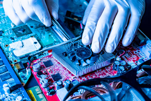 hands attach and assembre the cooler fan to the videocard chip slot